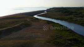 Drone flight over Barmouth beach talybont River sunset calm sea