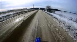 Driving motorcycle in winter rider falls hard and quick right on his face!