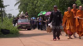 A funeral procession to the local crematorium in a village in Northern Thailand.