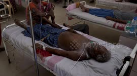 Victims of India's train disaster lie on hospital beds following deadly crash
