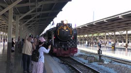 Steam train leaves Bangkok in celebration of the Queen of Thailand's birthday.