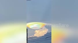 Spectacular lens-shaped iridescent cloud shines in sky over northeast Thailand