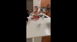 One-year-old girl lands bottle flip TWICE in a row
