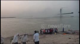 Indian bridge collapses for SECOND TIME and splashes into Ganges River (best-quality video)