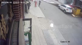 Billboard blown by strong wind knocks down three women in China