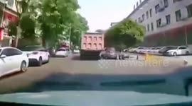 Sinkhole swallows dump truck carrying gravel in China