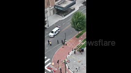 Police cars surround cordoned-off area following after shooting in Virginia, US