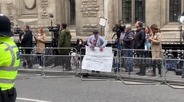 East 17's Brian Harvey seen protesting outside court ahead of Prince Harry's arrival