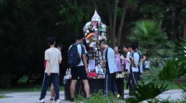 Chinese students seek success in college entrance exam with rituals at Newton statue