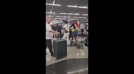 Fists Fly at Baggage Claim Brawl