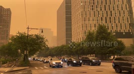 Wildfire smoke shrouds Lower Manhattan and Hudson River