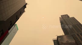Smoky conditions from wildfires in Canada turned Times Square and the streets of New York City hues of orange on Wednesday morning