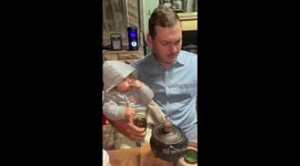 'Nobody is gonna know' - Sneaky baby lets her fingers go for a swim in daddy's drink