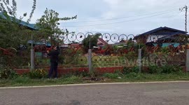 Resident recycles old bikes to make garden wall around his house