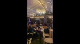 Drunk man falls off the stage during a wedding dance with friends
