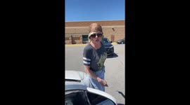 Woman stands in front of car during HEATED debate over parking space