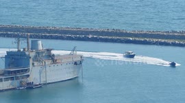 Armed police training with fast patrol ribs before arrival of immigration barge in Dorset