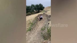 BMX rider crashes into dirt jump without taking off