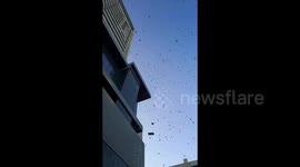 Chinese man throws bank notes out of high-rise window to expose alleged criminal gang threats