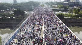 shows Christian groups marching in Sao Paulo to mark Corpus Christi Day
