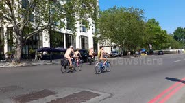 Hundreds of cyclists go nude in 31C weather and take part in World Naked Bike Ride in London