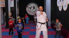 Palestinian children train Karate at a local club during the summer holiday, in Gaza city