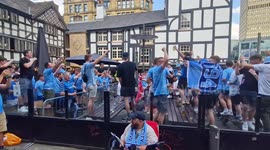 City fans chant in Manchester's Northern Quarter ahead of Champions League final