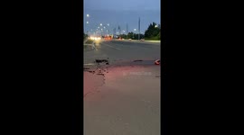 close call between tow truck and car at accident site