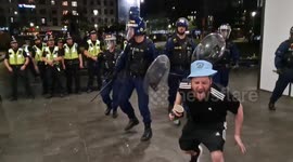 Police officer strikes Man City fan with baton after celebrations turn sour