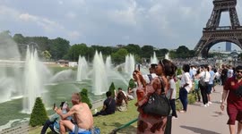 Parisian heatwave: Tourists and locals flock to Trocadero fountain as Eiffel Tower becomes a cooling oasis