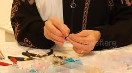A Russian artist, Alexandra El Hajjar makes a handmade accessories at a workshop in Gaza city