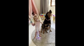 Rottweiler and Toddler Sing Their Favorite Songs Together