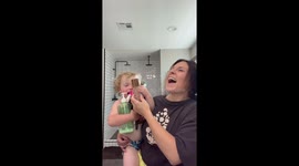 Mother does the viral 'Can you Hold' challenge with her adorable toddler