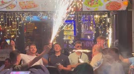 Man City fans party all day in Istanbul after winning the UEFA Champions League final. Many flares were used in the good hearted celebrations outside the popular bars. There were no incidents of trouble or violence