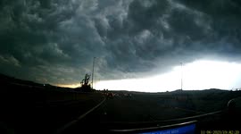 Dashcam of dark clouds at Birmingham UK, just before heavy rain and lightning.