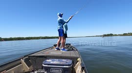 Fisherman Hooks a Huge Largemouth Bass on a Glide Bait