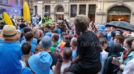 City team bus parade clears road as massive crowd overflows in Manchester