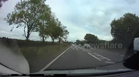 Front Dashcam catches moment truck slams into back of UK driver pushing vehicle into car in front