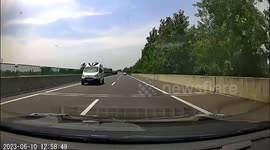 Ambulance's wrong-way drive in China narrowly escapes from collision
