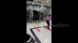 Woman helplessly blown indoors by strong winds in China, sliding metres away