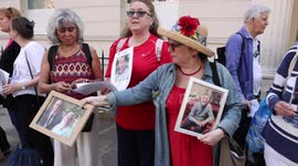 UK Covid-19 Inquiry: Families hold pictures of loved ones who died, outside hearing centre