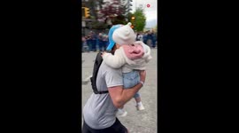SURREAL moment as dad finishes Marathon while holding his toddler daughter