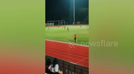Pet dog runs onto football pitch and chases ball
