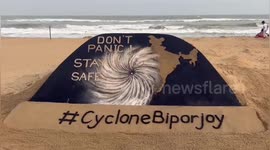 Indian sand artist created a sand sculpture on cyclone Biparjoy which will land fall near Gujarat with message