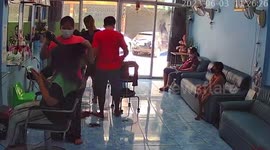 Hairdryer catches fire in salon while beautician styles client