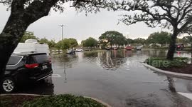 Flooded car parking in Davie, Florida, as severe thunderstorm brings heavy rain