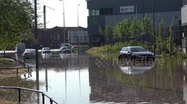 Eleven vehicles submerged in floods after water main bursts in Birmingham, England closing major road near M6 Motorway