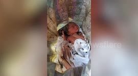 Newborn girl 'thought dead by parents' rescued after being dumped at landfill in the Philippines