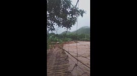 Flash floods suddenly appeared, washed away a bridge, and isolated the village on the high mountain