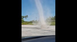 Quickly Moving Dust Devil In Staff Parking